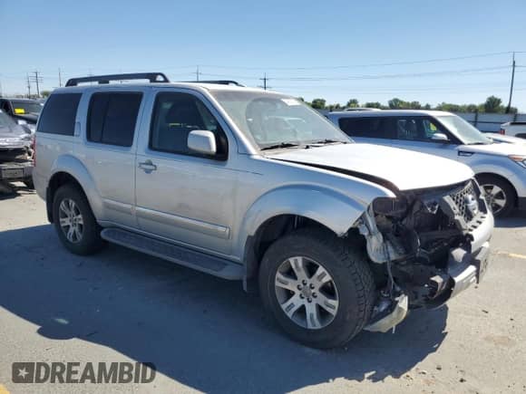 2011 Nissan Pathfinder LE z VIN 5N1AR1NB4BC630322, wystawiony jako Copart lot #64050515 z przebiegiem 251 886 mil mil oraz Szkoda całkowita • Salvage title. Historia ofert i sprzedaży dostępna na DreamBid. Obrazek 4.