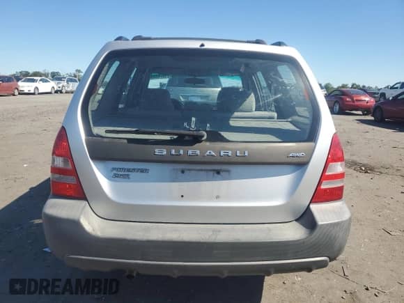 2004 Subaru Forester X with VIN JF1SG63664H744285, listed as a Copart auction lot 71876025 with 118,309 mi miles and Salvage title. Bid and sale history available at DreamBid. Image 6.
