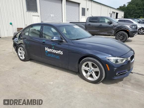 2016 BMW 3 Series 328i with VIN WBA8E9G51GNU29989, listed as a Copart auction lot 69111065 with 82,574 mi miles and Salvage title. Bid and sale history available at DreamBid. Image 4.