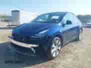 2023 Tesla Model Y Long Range with VIN 7SAYGDEE4PA125024, listed as a IAAI auction lot 43252218 with 21,200 mi miles and . Bid and sale history available at DreamBid. Image 20.