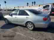 2005 Toyota Camry LE с VIN JTDBF30KX50160730, выставлен на аукционе Copart как лот 84997435 с пробегом 238 964 миль миль и Списание • Salvage title. История ставок и продаж доступна на DreamBid. Изображение 2.