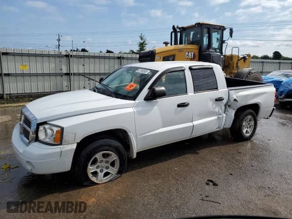 2006 Dodge Dakota SLT с VIN 1D7HE48N86S525225, выставлен на аукционе Copart как лот 67768595 с пробегом Не указан миль и Списание • Salvage title. История ставок и продаж доступна на DreamBid. Изображение 1.