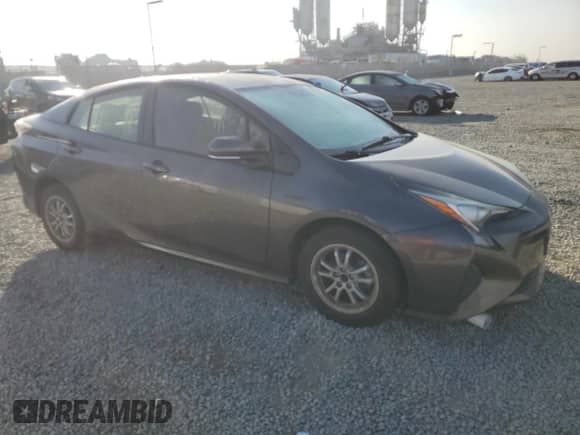 2016 Toyota Prius Two with VIN JTDKBRFU4G3506540, listed as a Copart auction lot 89698125 with 94,964 mi miles and Salvage title. Bid and sale history available at DreamBid. Image 4.