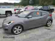 2014 Hyundai Veloster z VIN KMHTC6AD8EU196161, wystawiony jako Copart lot #82244385 z przebiegiem 146 717 mil mil oraz Czysty tytuł • Clean title. Historia ofert i sprzedaży dostępna na DreamBid. Obrazek 1.