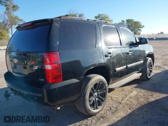 2007 Chevrolet Tahoe LTZ with VIN 1GNFK13027R249676, listed as a IAAI auction lot 43424132 with 296,751 mi miles and . Bid and sale history available at DreamBid. Image 4.