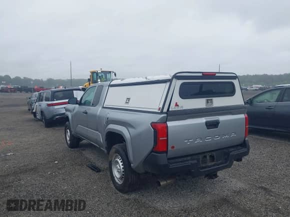 2024 Toyota Tacoma SR with VIN 3TYJDAHN7RT010103, listed as a IAAI auction lot 43009091 with 10,678 mi miles and . Bid and sale history available at DreamBid. Image 3.