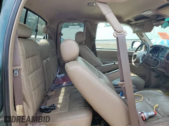 2001 Toyota Tundra Limited z VIN 5TBBT48101S167986, wystawiony jako Copart lot #64989255 z przebiegiem 217 919 mil mil oraz Czysty tytuł • Clean title. Historia ofert i sprzedaży dostępna na DreamBid. Obrazek 10.