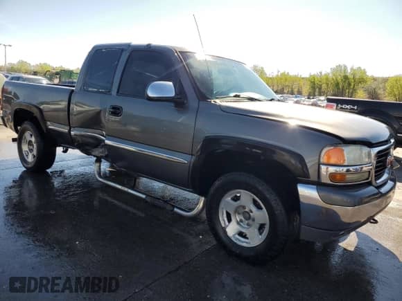 2002 GMC Sierra 1500 SLE with VIN 2GTEK19T121261468, listed as a Copart auction lot 55957305 with 245,099 mi miles and Salvage title. Bid and sale history available at DreamBid. Image 4.