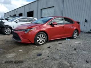 2021 Toyota Corolla LE with VIN JTDEPMAE9MJ185880, listed as a Copart auction lot 82162075 with 82,157 mi miles and Salvage title. Bid and sale history available at DreamBid. Image 1.