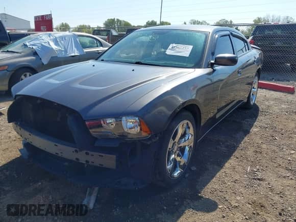 2014 Dodge Charger SE with VIN 2C3CDXBG2EH364318, listed as a IAAI auction lot 43365253 with 105,597 mi miles and . Bid and sale history available at DreamBid. Image 2.