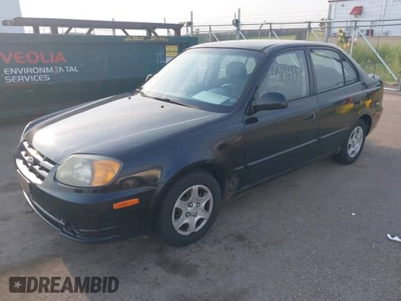 2005 Hyundai Accent GLS z VIN KMHCG45C55U587584, wystawiony jako IAAI lot #42864972 z przebiegiem 122 849 mil mil oraz . Historia ofert i sprzedaży dostępna na DreamBid. Obrazek 2.
