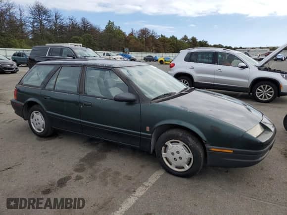 1995 Saturn SW with VIN 1G8ZH828XSZ342548, listed as a Copart auction lot 74506384 with 67,104 mi miles and Clean title. Bid and sale history available at DreamBid. Image 4.