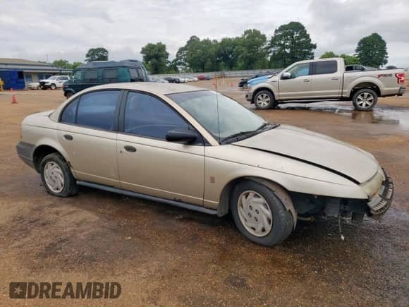 1997 Saturn SL with VIN 1G8ZF5284VZ404812, listed as a Copart auction lot 58836015 with 201,792 mi miles and Salvage title. Bid and sale history available at DreamBid. Image 4.