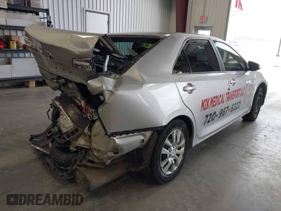 2013 Toyota Camry LE z VIN 4T1BD1FK8DU064728, wystawiony jako IAAI lot #42398146 z przebiegiem 100 867 mil mil oraz . Historia ofert i sprzedaży dostępna na DreamBid. Obrazek 4.