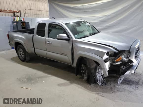 2019 Toyota Tacoma SR5 with VIN 5TFSZ5ANXKX180359, listed as a Copart auction lot 71621945 with 64,167 mi miles and Salvage title. Bid and sale history available at DreamBid. Image 4.