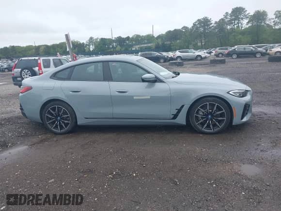 2022 BMW i4 eDrive40 with VIN WBY73AW00NFN14842, listed as a IAAI auction lot 42313404 with 23,556 mi miles and . Bid and sale history available at DreamBid. Image 13.
