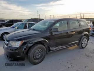 2014 Dodge Journey American Value with VIN 3C4PDCAB1ET283961, listed as a Copart auction lot 65348255 with 200,998 mi miles and Salvage title. Bid and sale history available at DreamBid. Image 1.
