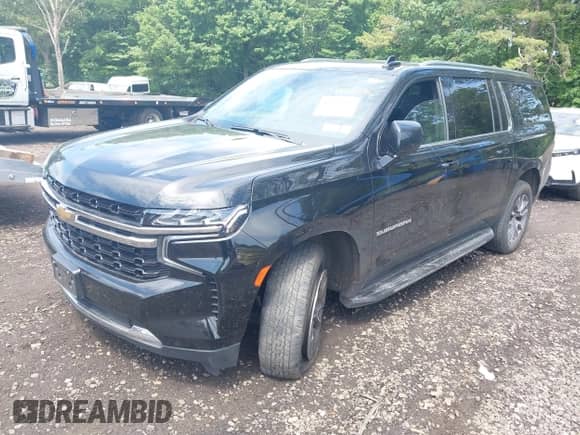 2023 Chevrolet Suburban LS z VIN 1GNSKBKD7PR110877, wystawiony jako IAAI lot #42519916 z przebiegiem 96 608 mil mil oraz . Historia ofert i sprzedaży dostępna na DreamBid. Obrazek 2.
