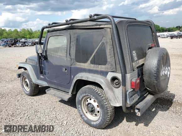 2001 Jeep Wrangler SE with VIN 1J4FA29P41P355548, listed as a Copart auction lot 56214205 with 173,125 mi miles and Clean title. Bid and sale history available at DreamBid. Image 2.