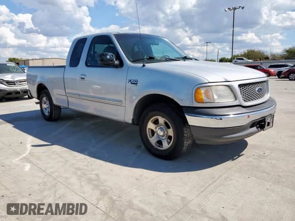 1999 Ford F-150 XL z VIN 1FTRX17LXXNA15191, wystawiony jako Copart lot #85282595 z przebiegiem 190 199 mil mil oraz Czysty tytuł • Clean title. Historia ofert i sprzedaży dostępna na DreamBid. Obrazek 4.
