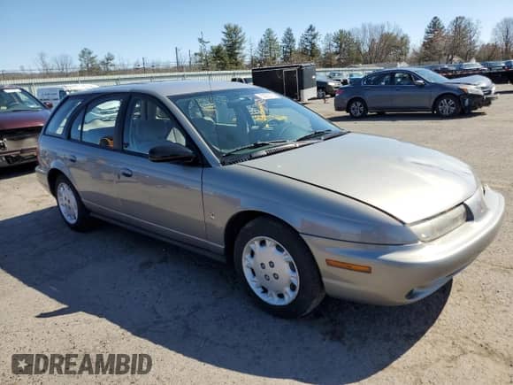 1997 Saturn SW with VIN 1G8ZK8274VZ194085, listed as a Copart auction lot 50230135 with 211,051 mi miles and Salvage title. Bid and sale history available at DreamBid. Image 4.