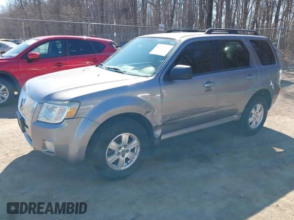 2008 Mercury Mariner with VIN 4M2CU91148KJ50412, listed as a IAAI auction lot 41715972 with 130,426 mi miles and . Bid and sale history available at DreamBid. Image 2.