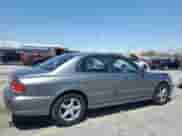 2002 Hyundai Sonata z VIN KMHWF25S72A624112, wystawiony jako Copart lot #56196195 z przebiegiem 54 206 mil mil oraz Szkoda całkowita • Salvage title. Historia ofert i sprzedaży dostępna na DreamBid. Obrazek 3.