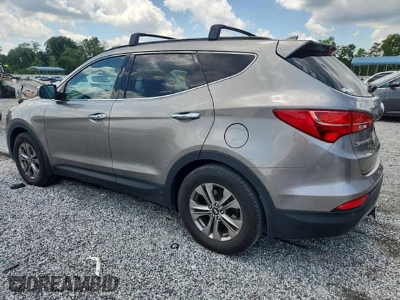 2015 Hyundai Santa Fe z VIN 5XYZUDLB1FG294690, wystawiony jako Copart lot #65039015 z przebiegiem 144 835 mil mil oraz Szkoda całkowita • Salvage title. Historia ofert i sprzedaży dostępna na DreamBid. Obrazek 2.
