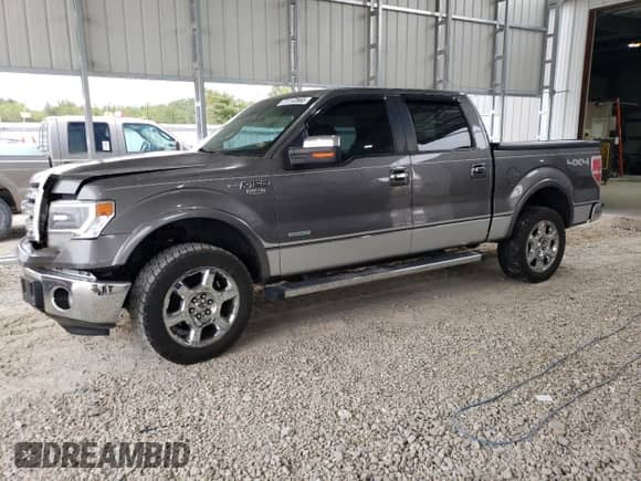 2013 Ford F-150 Lariat with VIN 1FTFW1ET2DFC87796, listed as a Copart auction lot 71112565 with 207,394 mi miles and Salvage title. Bid and sale history available at DreamBid. Image 1.