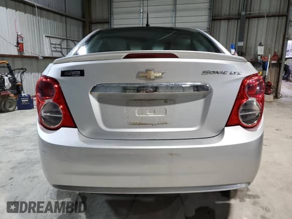 2013 Chevrolet Sonic LTZ with VIN 1G1JE5SH6D4102528, listed as a Copart auction lot 47419475 with 129,812 mi miles and Salvage title. Bid and sale history available at DreamBid. Image 6.