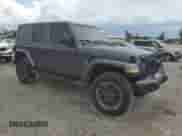 2021 Jeep Wrangler Unlimited Sahara High Altitude with VIN 1C4HJXENXMW617406, listed as a Copart auction lot 65618415 with 40,725 mi miles and Salvage title. Bid and sale history available at DreamBid. Image 4.