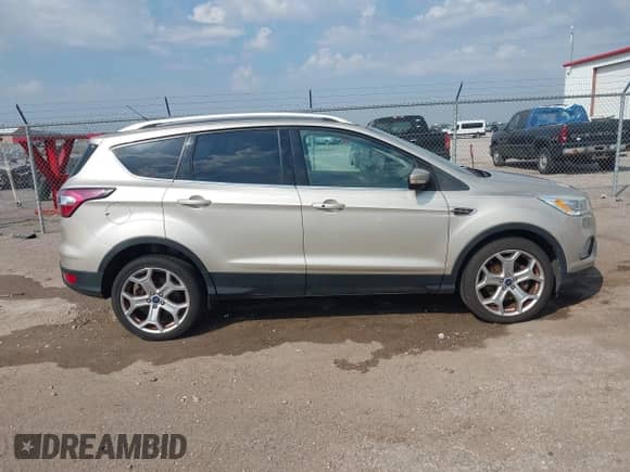 2017 Ford Escape Titanium with VIN 1FMCU9J9XHUD90656, listed as a IAAI auction lot 43216695 with 109,897 mi miles and . Bid and sale history available at DreamBid. Image 13.