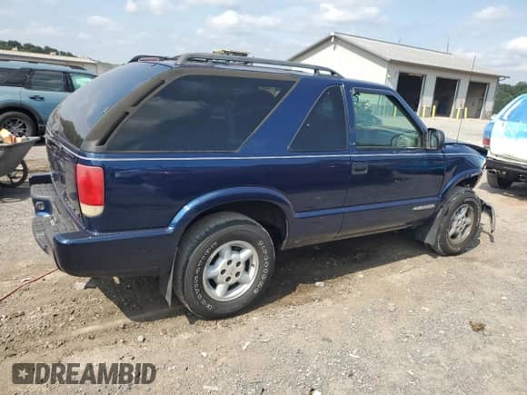 2000 Chevrolet Blazer LS с VIN 1GNCT18W3YK104430, выставлен на аукционе Copart как лот 68858864 с пробегом 47 342 миль миль и Списание • Salvage title. История ставок и продаж доступна на DreamBid. Изображение 3.