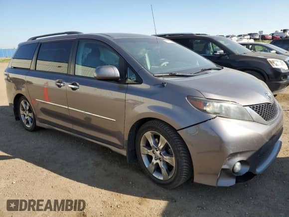 2011 Toyota Sienna SE with VIN 5TDXK3DC0BS077515, listed as a Copart auction lot 70179025 with 220,045 mi miles and Salvage title. Bid and sale history available at DreamBid. Image 4.