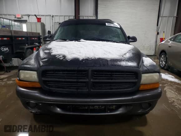 2002 Dodge Dakota z VIN 1B7FL16X32S557570, wystawiony jako Copart lot #88974295 z przebiegiem 201 791 mil mil oraz Szkoda całkowita • Salvage title. Historia ofert i sprzedaży dostępna na DreamBid. Obrazek 5.