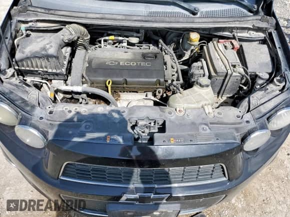 2012 Chevrolet Sonic LT z VIN 1G1JD6SH0C4152025, wystawiony jako Copart lot #65154675 z przebiegiem 154 760 mil mil oraz Szkoda całkowita • Salvage title. Historia ofert i sprzedaży dostępna na DreamBid. Obrazek 11.