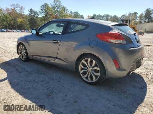 2013 Hyundai Veloster w/Black Int z VIN KMHTC6AD2DU144524, wystawiony jako Copart lot #86604965 z przebiegiem 101 979 mil mil oraz Czysty tytuł • Clean title. Historia ofert i sprzedaży dostępna na DreamBid. Obrazek 2.