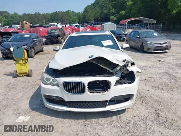 2013 BMW 7 Series 740Li with VIN WBAYE4C58DDW22876, listed as a IAAI auction lot 42418789 with 174,313 mi miles and . Bid and sale history available at DreamBid. Image 12.