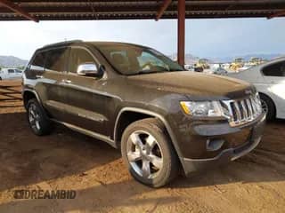 2012 Jeep Grand Cherokee Overland z VIN 1C4RJECT1CC301144, wystawiony jako IAAI lot #42760348 z przebiegiem 59 939 mil mil oraz . Historia ofert i sprzedaży dostępna na DreamBid. Obrazek 1.