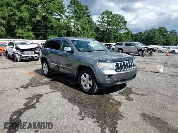 2012 Jeep Grand Cherokee Limited z VIN 1C4RJEBG7CC276299, wystawiony jako Copart lot #64085755 z przebiegiem 86 272 mil mil oraz Szkoda całkowita • Salvage title. Historia ofert i sprzedaży dostępna na DreamBid. Obrazek 14.
