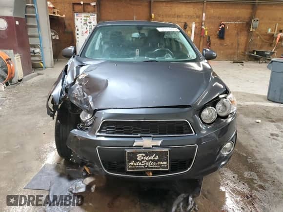 2014 Chevrolet Sonic LTZ с VIN 1G1JE5SB1E4177277, выставлен на аукционе Copart как лот 52375035 с пробегом Не указан миль и Списание • Salvage title. История ставок и продаж доступна на DreamBid. Изображение 5.