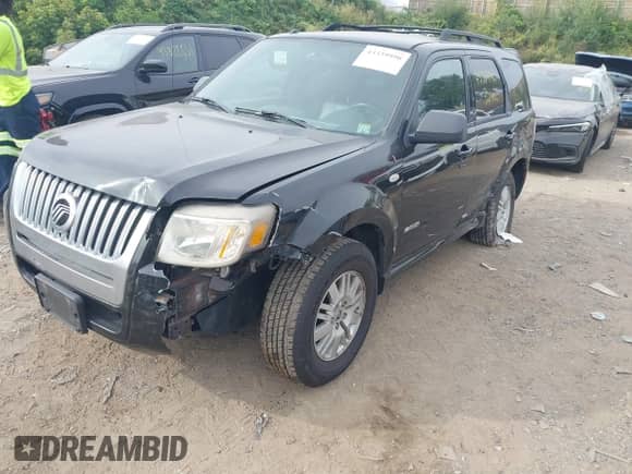 2008 Mercury Mariner with VIN 4M2CU91108KJ51427, listed as a IAAI auction lot 43339990 with 227,044 mi miles and . Bid and sale history available at DreamBid. Image 6.