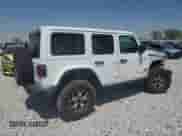 2022 Jeep Wrangler Unlimited Rubicon with VIN 1C4HJXFG5NW232868, listed as a Copart auction lot 79216714 with 18,889 mi miles and Salvage title. Bid and sale history available at DreamBid. Image 3.