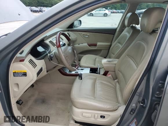 2006 Hyundai Azera SE with VIN KMHFC46FX6A135022, listed as a Copart auction lot 69843315 with 218,656 mi miles and Salvage title. Bid and sale history available at DreamBid. Image 7.