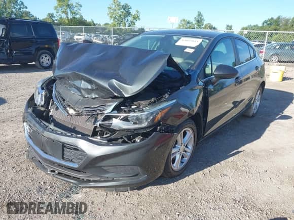 2018 Chevrolet Cruze LT with VIN 3G1BE6SM3JS552270, listed as a IAAI auction lot 43057813 with 103,833 mi miles and . Bid and sale history available at DreamBid. Image 2.