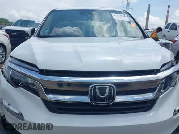 2021 Honda Pilot EX-L with VIN 5FNYF6H58MB075055, listed as a IAAI auction lot 42521760 with 59,336 mi miles and . Bid and sale history available at DreamBid. Image 12.