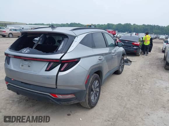 2022 Hyundai Tucson Blue with VIN KM8JBCA1XNU077977, listed as a IAAI auction lot 42868058 with 76,081 mi miles and . Bid and sale history available at DreamBid. Image 4.