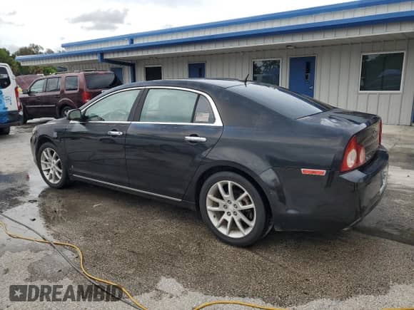 2009 Chevrolet Malibu LTZ with VIN 1G1ZK57B69F136853, listed as a Copart auction lot 71663625 with 154,853 mi miles and Salvage title. Bid and sale history available at DreamBid. Image 2.