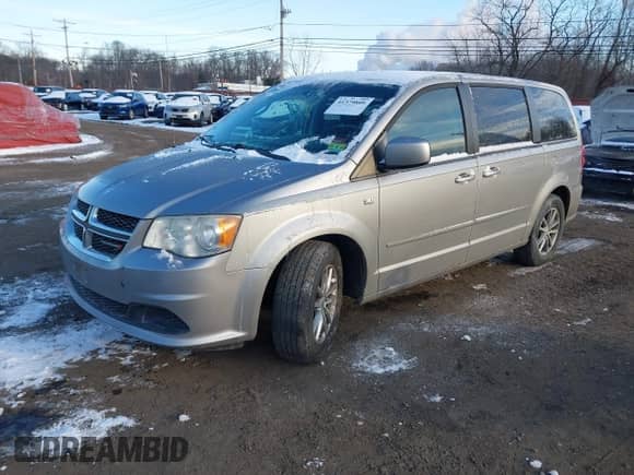 2014 Dodge Grand Caravan American Value with VIN 2C4RDGBG8ER376831, listed as a IAAI auction lot 41379809 with 142,101 mi miles and . Bid and sale history available at DreamBid. Image 17.