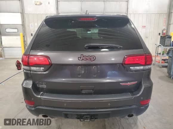 2018 Jeep Grand Cherokee Trailhawk с VIN 1C4RJFLG2JC227951, выставлен на аукционе Copart как лот 81715465 с пробегом 128 266 миль миль и Списание • Salvage title. История ставок и продаж доступна на DreamBid. Изображение 6.